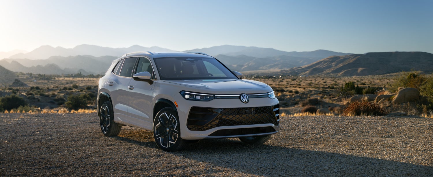 2026 Volkswagen tiguan parked on a gravel road in the mountains